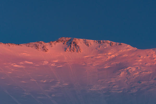 Sunset to the north face of peak Lenin, 7134 meters high. Peak Lenin camp one, Pamir, Kyrgyzstan, Central Asia. 