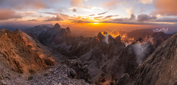 Catinaccio group panorama from Catinaccio di Antermoia summit during a summer sunset over mountains. Fassa valley, Trento district, Dolomites, Trentino Alto Adige, Italy, Europe.