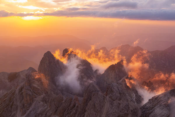 Mountains landscape in Catinaccio group from Catinaccio di Antermoia summit during a summer sunset over mountains. Fassa valley, Trento district, Dolomites, Trentino Alto Adige, Italy, Europe.