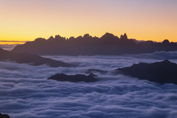 Sunrisescape of Dolomites mountains with Pale di San Martino group in background from Schenon mount. Pampeago, Cavalese, Fiemme valley, Trento district, Dolomites, Italy, Europe.