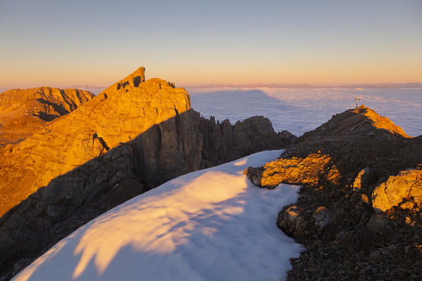 Cimon del Latemar during a summer sunrise from Schenon mount. Latemar group, Costalunga pass, Fassa valley, Pozza di Fassa, Trento district, Dolomites, Italy, Europe.