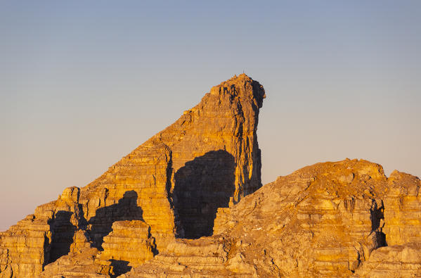 Cimon del Latemar peak during a summer sunrise from Schenon mount. Latemar group, Costalunga pass, Fassa valley, Pozza di Fassa, Trento district, Dolomites, Italy, Europe.