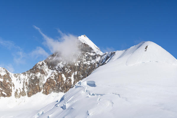 Lyskamm peak and its glacier and snow ridge in Rosa mount group. Gressoney, Aosta district, Valle d'Aosta, Alps, Italy, Europe. 