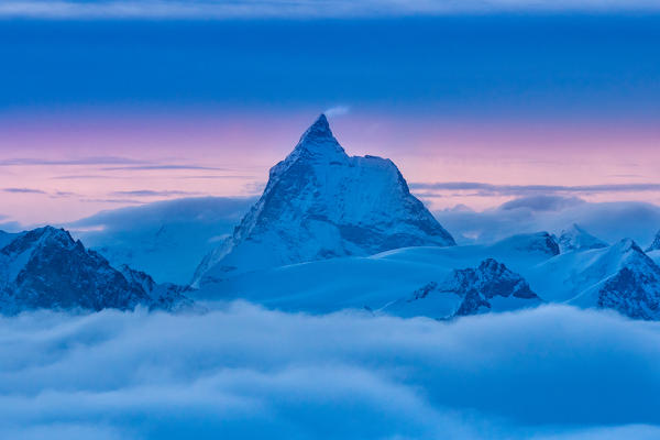 Matterhorn peak at dusk from Igloo refuge es Pantalons Blancs in Swiss Alps mountains. Heremence, Sion, Valais canton, Switzerland, Europe.