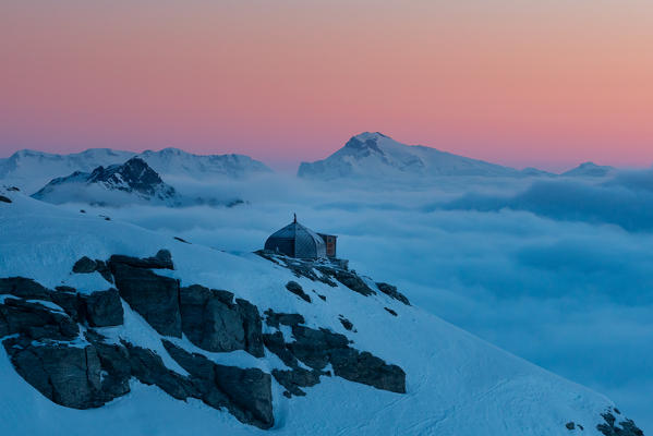 Sunrisescape of Igloo refuge des Pantalons Blancs in Swiss Alps mountains. Heremence, Sion, Valais canton, Switzerland, Europe.