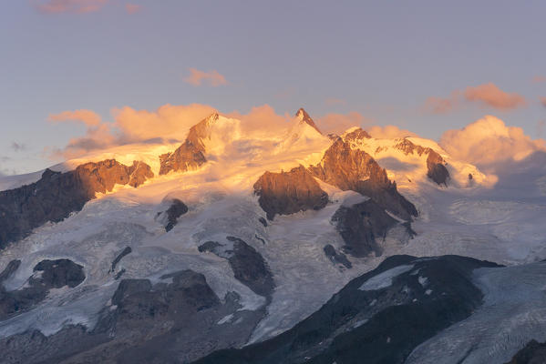 Dufour and Nordend peaks in Rosa mount at sunset from Gandegghutte in Zermatt valley. Zermatt, Vallese canton, Switzerland, Alps, Europe. 