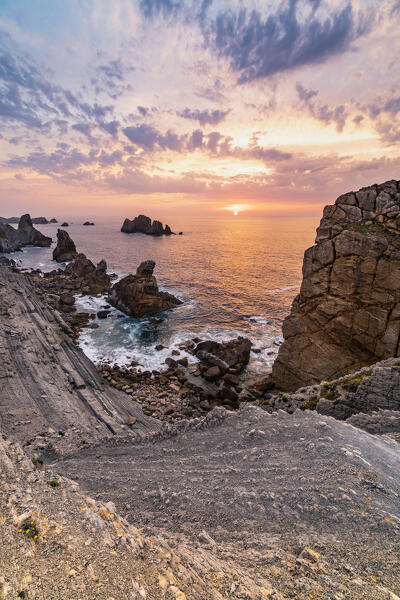 Rocky beach in the cantabrian sea of Costa Quebrada at sunset. Playa del Portio, Liencres, Cantabria, Spain, Europe.