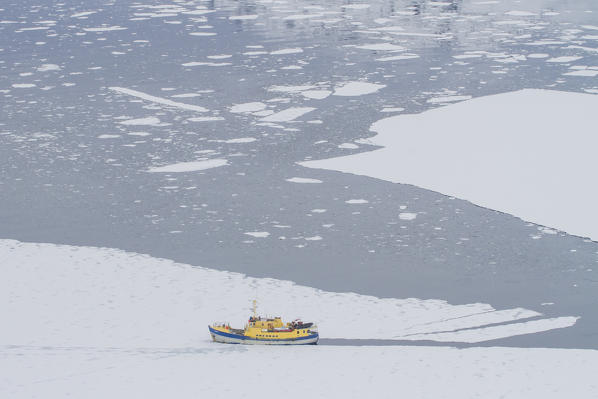 A Boat in an iced fjord of Greenland, Artic sea, Denmark