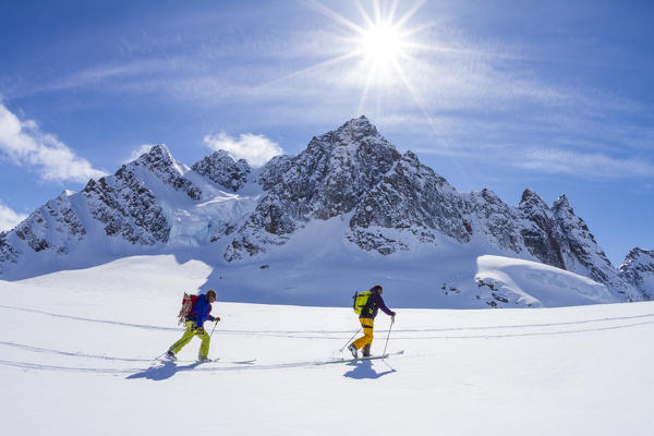 Ski mountaneers on the snow of Greenland mountains. Greenland, Artic sea, Denmark