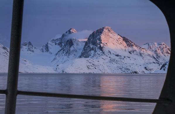 Sunset view from a boat in a fjord of west coast of Greenland, Artic sea, Denmark