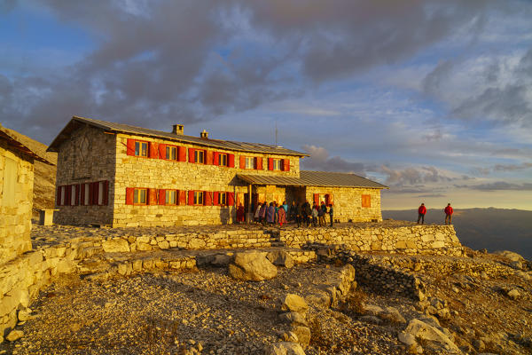 Peruvians people at refuge Huascaran during sunset. Ancash, Cordigliera Blanca, Peru