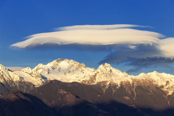 Lenticular clouds above Mount Disgrazia, Valtellina, Lombardy, Italy, Europe.