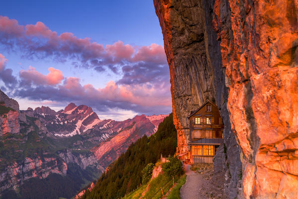 Red light of sunrise at Berggasthaus Aescher, Canton of Appenzell, Alpstein, Switzerland, Europe