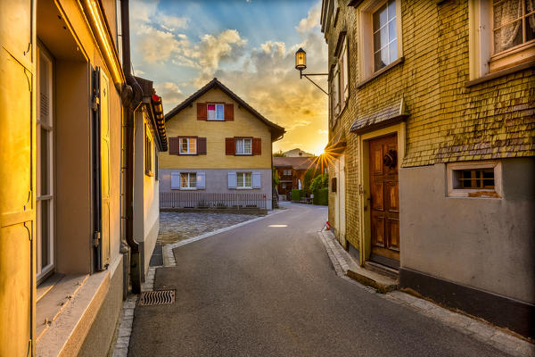 Sun rays filters between houses in the old town of Appenzell, Canton of Appenzell, Alpstein, Switzerland, Europe