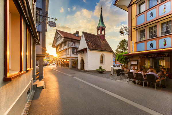 Sun rays filters between houses in the old town of Appenzell, Canton of Appenzell, Alpstein, Switzerland, Europe