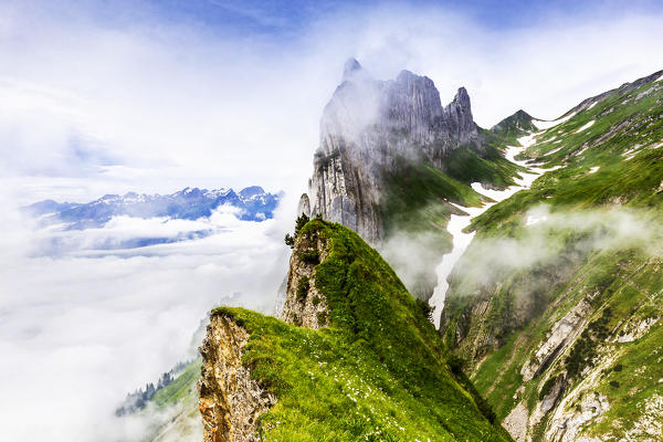 Chruzberg mountain appears among clouds, Canton of Appenzell, Alpstein, Switzerland, Europe.