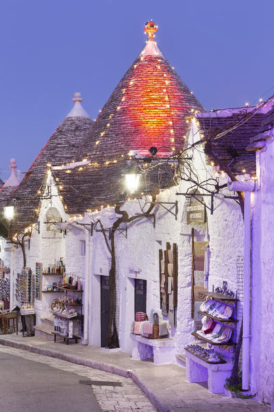 Traditional trullo house illuminated by christmas lights. Unesco World Heritage Site, Alberobello, Province of Bari, Apulia, Italy, Europe.