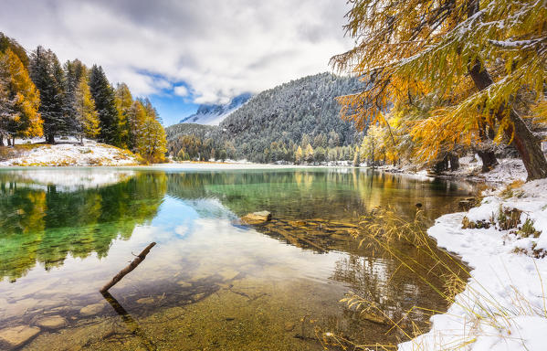 Palpuognasee in autumn after a snowfall.  Palpuognasee, Canton of Graubunden, Switzerland.