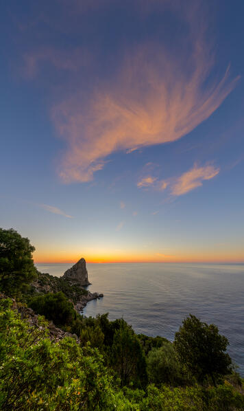 Colorful cloud above Pedra Longa at sunrise, Baunei, Ogliastra province, Sardinia, Italy, Europe