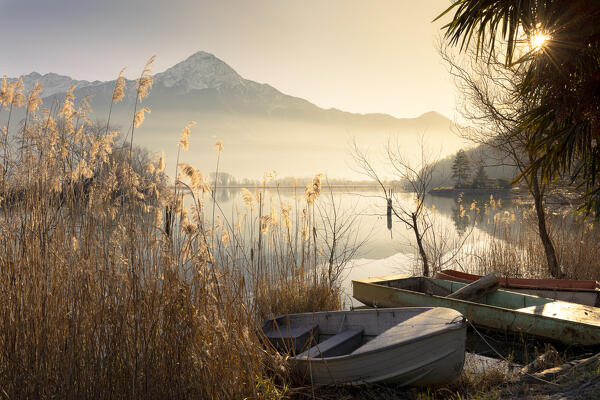 Foggy sunset light on the Mezzola lake, Lombardy, Italy, Europe.