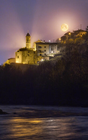 Sunset of moon with Sassella Sanctuary in the foreground, Valtellina, Lombardy, Italy, Europe