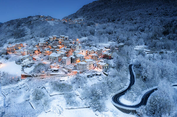 Aerial view of Sant'Anna village at dusk after a snowfall, Valtellina, Lombardy, Italy, Europe