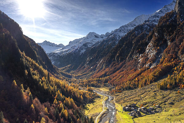 Aerial view of Val Bodengo in autumn with the village of Corte Terza in the foreground. Valchiavenna, Valtellina, Lombardy, Italy, Europe.