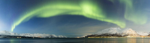 Northern lights over the fjord.Skivahollet, Kafjord, Lyngen Alps, Troms, Norway, Lapland, Europe.