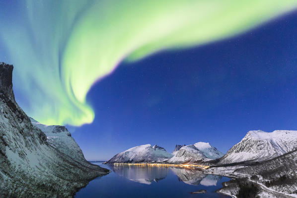 Northern lights in the night sky from panoramic point over Bergsfjorden. Bergsfjorden, Senja, Norway, Europe.