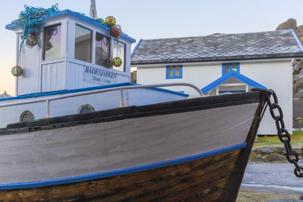 Boat moored in the village center of Hamn I Senja. Hamn I Senja, Senja, Norway, Europe.