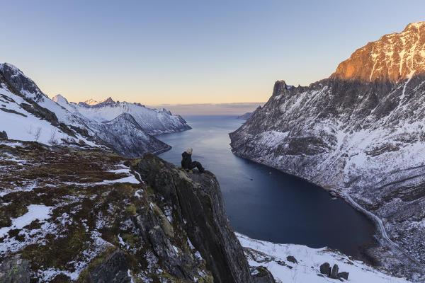Hikers watch the landscape on Oyfjorden. Barden, Mefjordbotn, Mefjorden, Senja, Norway, Europe.