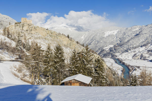 The castle of Ladis dominates the Inntal, whitewashed by a winter snowfall. Ladis, Inntal, Tirol, Osterreich, Europe