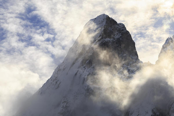 Sass de Putia appears in the clouds. Funes Valley, South Tyrol, Dolomites, Italy