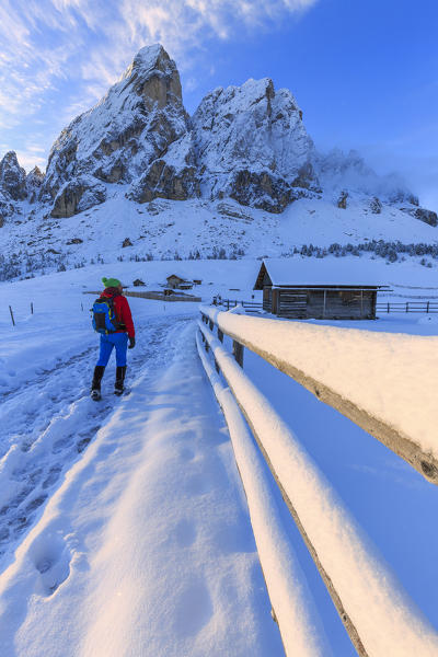 One person walking in the fresh snow. Erbe Pass, Funes Valley, South Tyrol, Dolomites, Italy