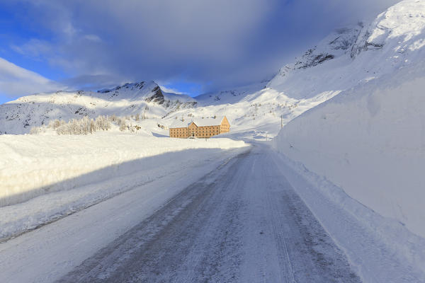 Hospice of the Simplon Pass illuminated by the sun after a heavy snowfall. Simplon Pass, Canton of  Valais/Wallis, Switzerland.