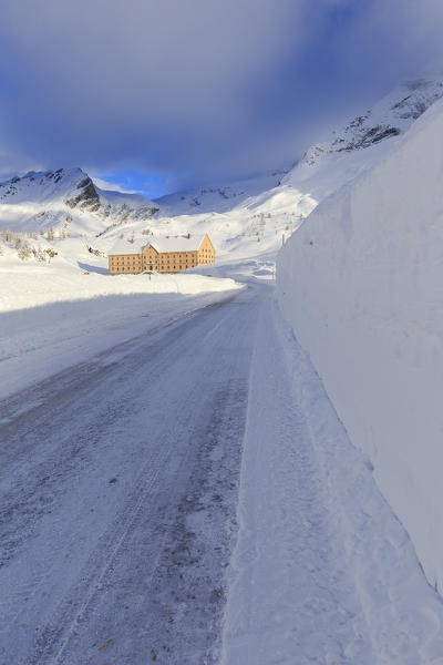 Hospice of the Simplon Pass illuminated by the sun after a heavy snowfall. Simplon Pass, Canton of  Valais/Wallis, Switzerland.