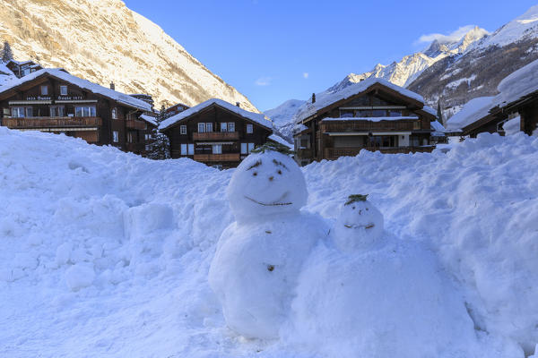 Snowmens between the houses of Zermatt, Canton of Valais / Wallis, Switzerland.