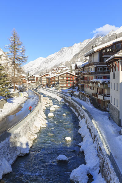 A person travels a route parallel to the Matter Vispa, the river that runs through Zermatt, Canton of Valais / Wallis, Switzerland.