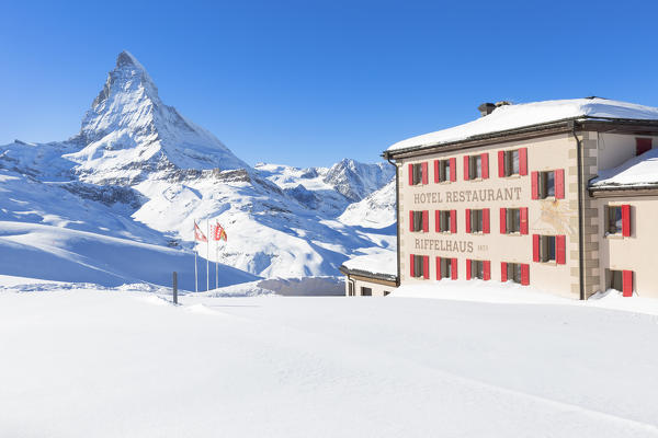 Riffelhaus Hotel and Restaurant in winter with Mattergorn in the background. Riffelberg, Zermatt, Canton of Valais / Wallis, Switzerland.