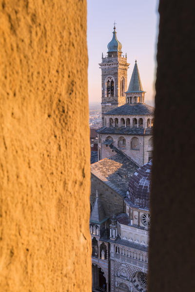 Basilica of Santa Maria Maggiore from a breach in the Civic Tower during sunset. Bergamo(Upper town), Lombardy, Italy.