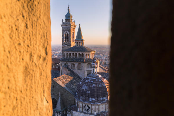 Basilica of Santa Maria Maggiore from a breach in the Civic Tower during sunset. Bergamo(Upper town), Lombardy, Italy.
