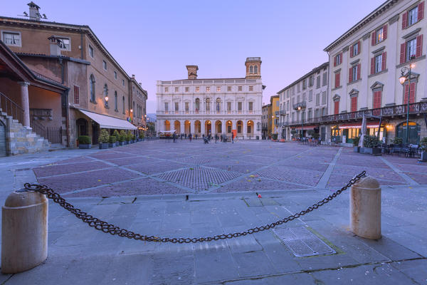Piazza Vecchia and Palazzo Nuovo (new Palace) during dusk. Bergamo, Lombardy, Italy.