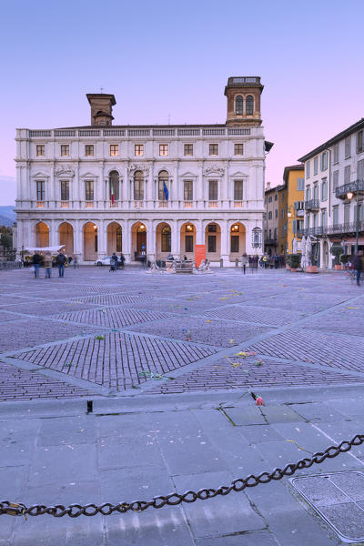 Piazza Vecchia and Palazzo Nuovo (new Palace) during dusk. Bergamo, Lombardy, Italy.