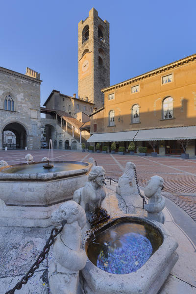 Piazza Vecchia with civic tower and Fontana del Contarini. Bergamo(Upper Town), Lombardy, Italy.