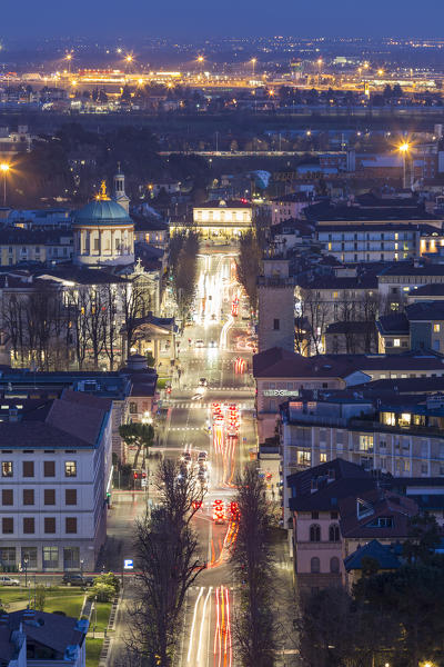 Lower town of Bergamo with Sentierone and Santa Maria delle Grazie Church during dusk. Bergamo, Lombardy, Italy.