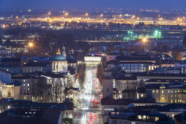 Lower town of Bergamo with Sentierone and Santa Maria delle Grazie Church during dusk. Bergamo, Lombardy, Italy.