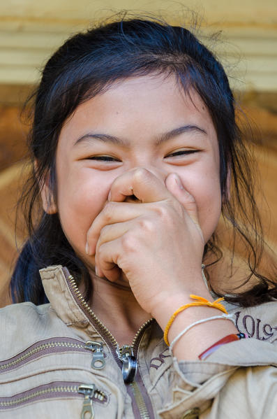 Vang, Vieng, Laos. The smile of a young Laotian girl.