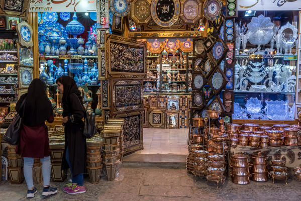 Isfahan, Isfahan Province, Iran, Central Asia. Young women shopping in Isfahan's bazaar