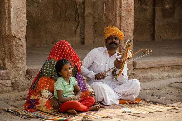 Jodhpur, Rajasthan, India. A family band plays to entertain tourists at the Mehrangarh Fort.