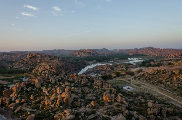 Hampi, Karnataka, India, Asia. A view of the ruing of the UNESCO World Heritage Site Hampi at sunset.